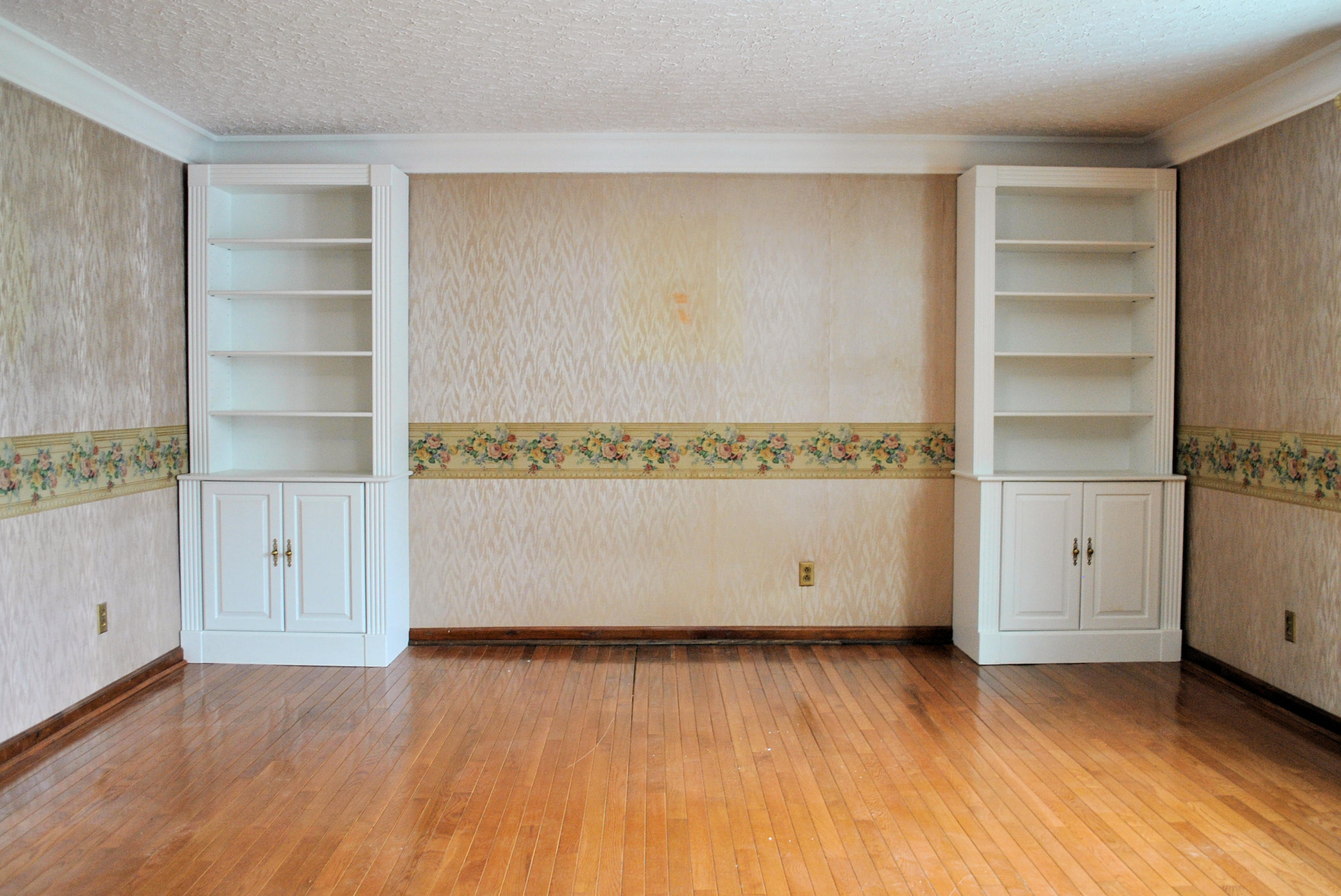 240 Fawn Lane Riner, VA 24149 - Photo 11 of 95 a view of an empty room with wooden floor and cabinet