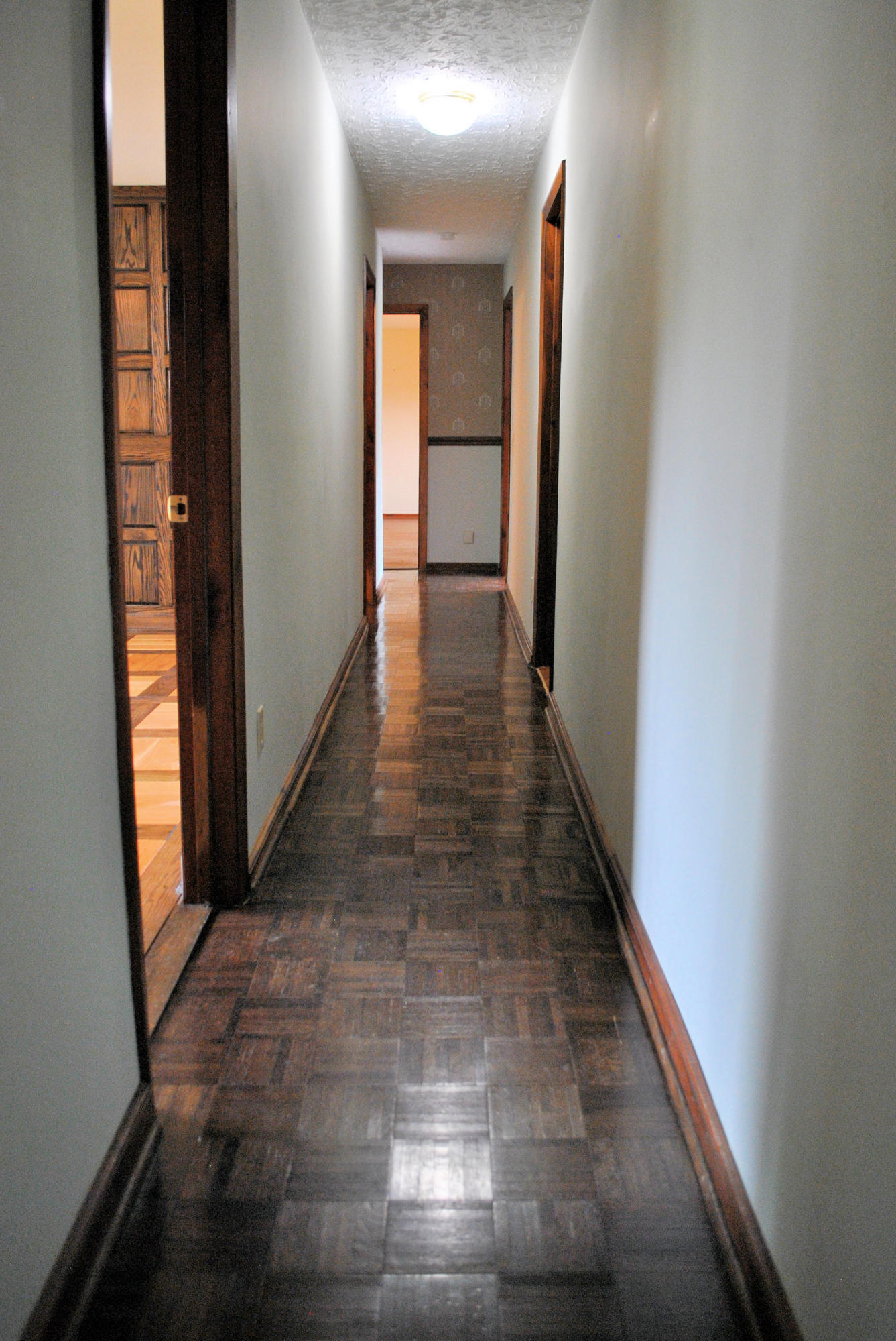 240 Fawn Lane Riner, VA 24149 - Photo 24 of 95 a view of a hallway with wooden floor