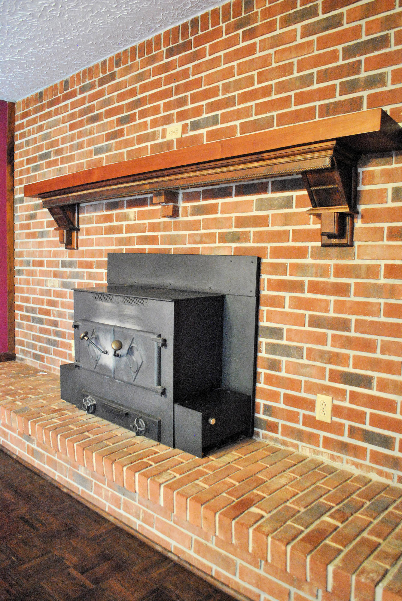 240 Fawn Lane Riner, VA 24149 - Photo 31 of 95 a view of a fireplace and a wooden floor