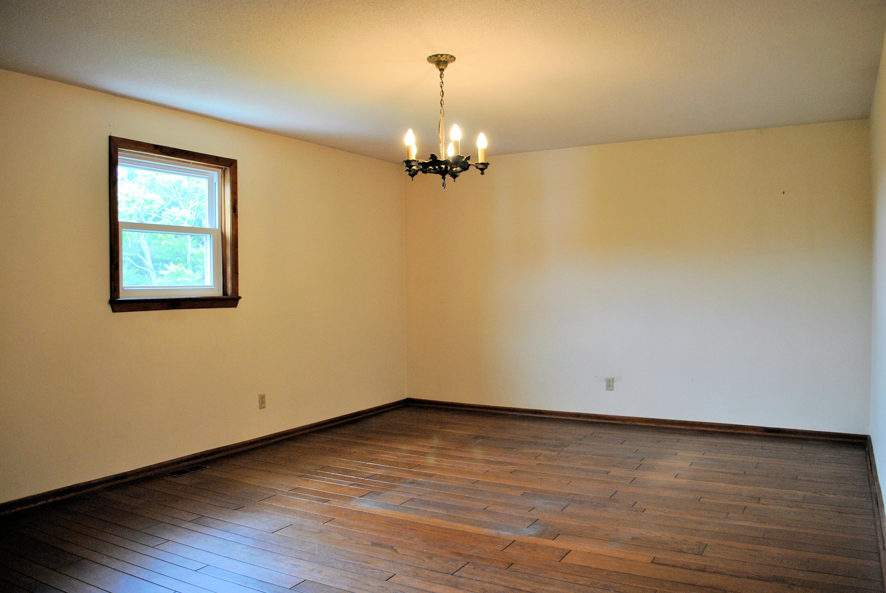240 Fawn Lane Riner, VA 24149 - Photo 33 of 95 a view of a room with wooden floor chandelier and a window
