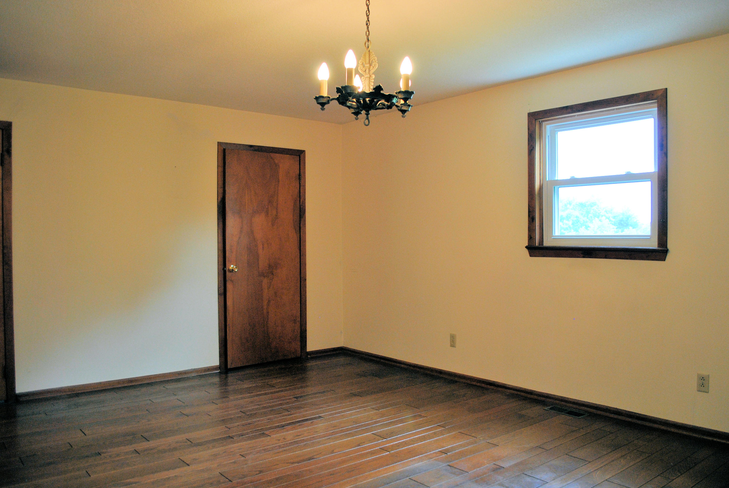 240 Fawn Lane Riner, VA 24149 - Photo 34 of 95 a view of a room with wooden floor chandelier and closet