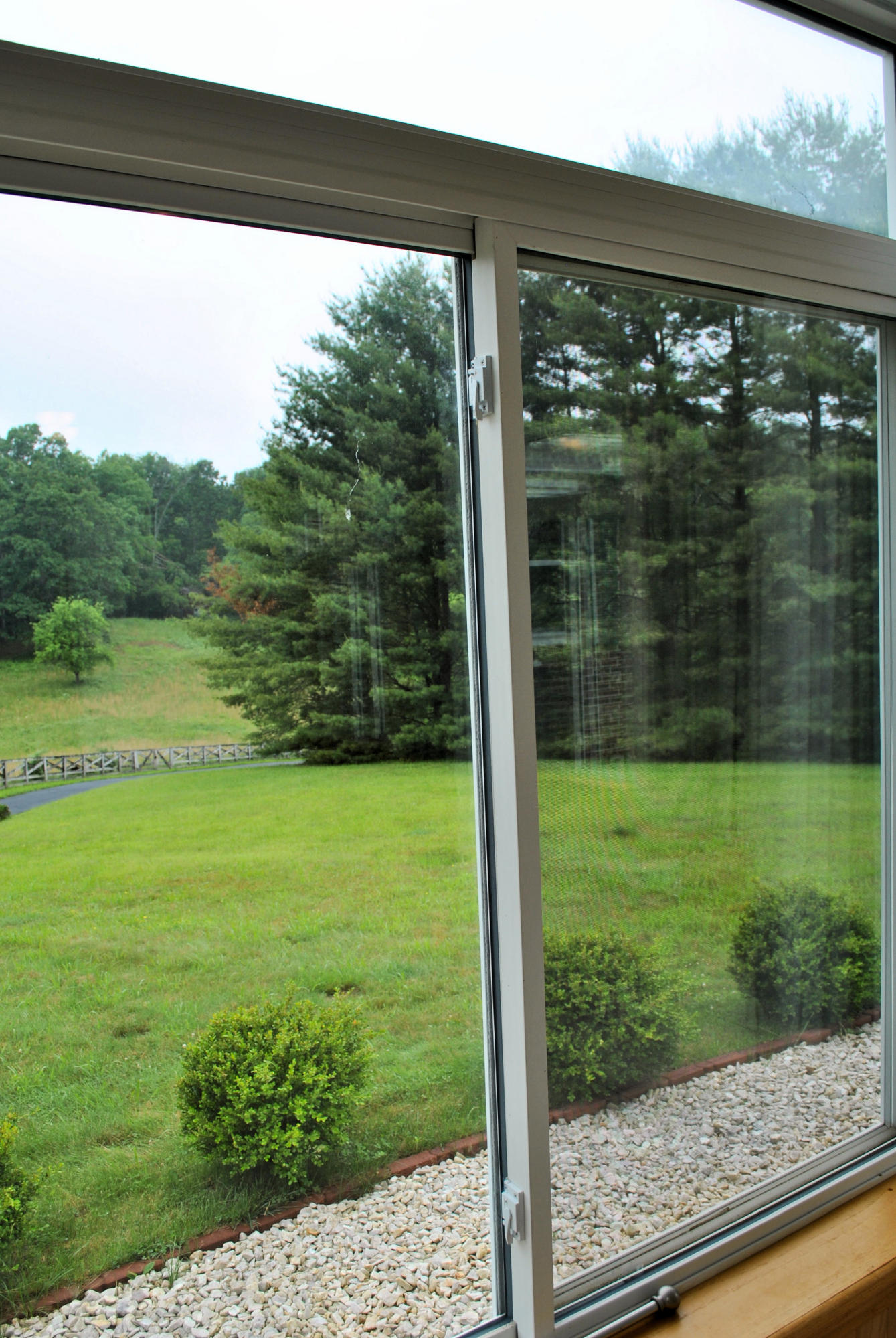 240 Fawn Lane Riner, VA 24149 - Photo 8 of 95 a view of a room with a large window and a yard