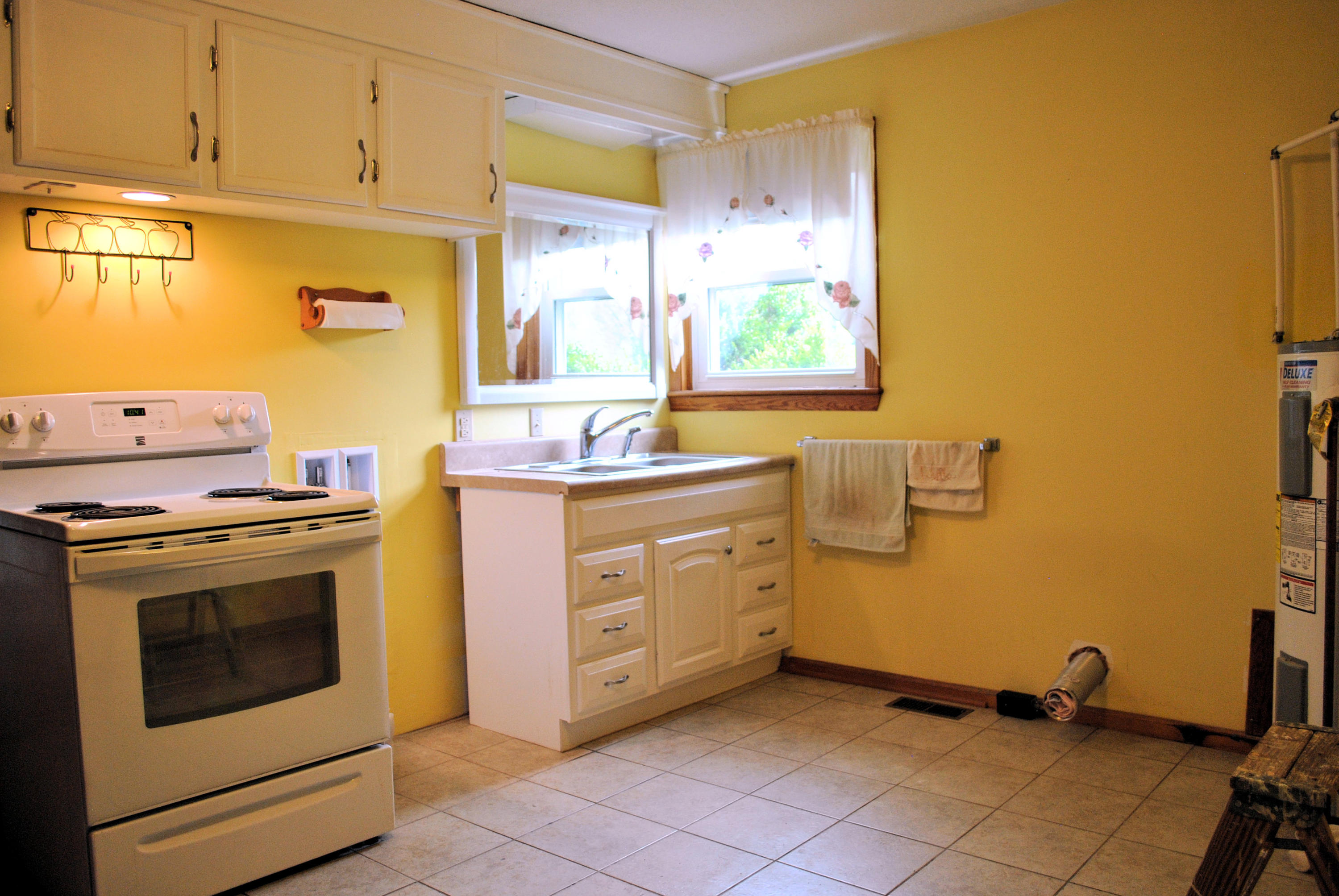 240 Fawn Lane Riner, VA 24149 - Photo 71 of 95 a kitchen with a stove sink and cabinets