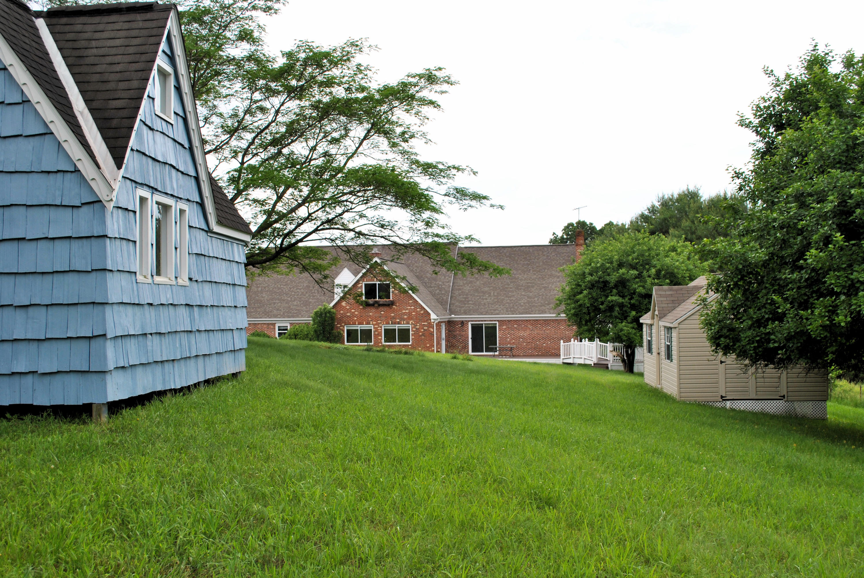240 Fawn Lane Riner, VA 24149 - Photo 88 of 95 a view of a house with a yard potted plants and large tree