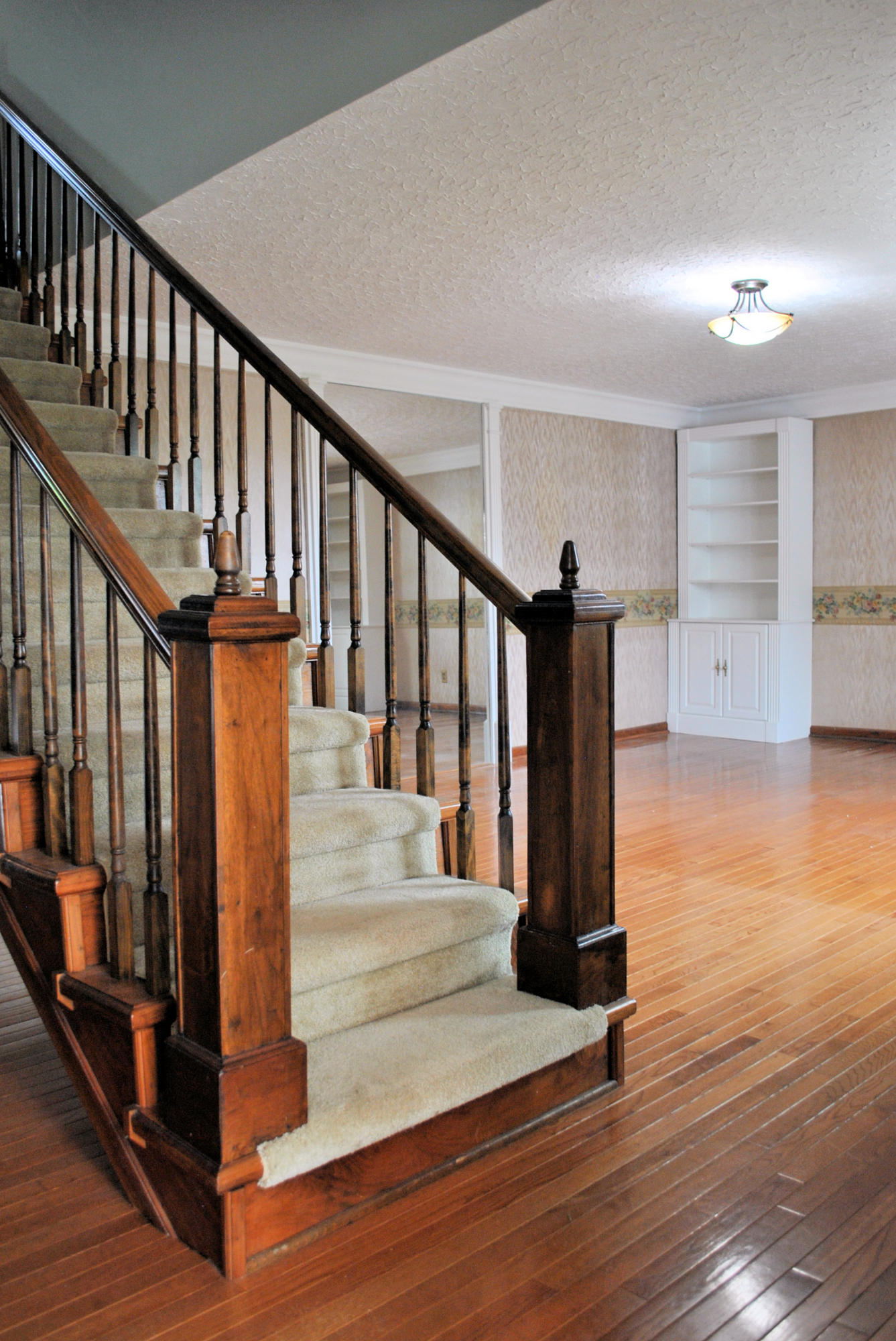 240 Fawn Lane Riner, VA 24149 - Photo 10 of 95 a view of entryway with wooden floor and stairs