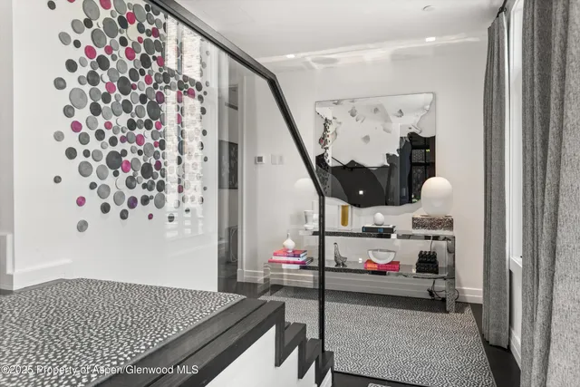 a bed room with a bed and a large window