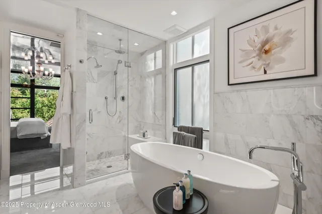 a bathroom with a shower sink and toilet