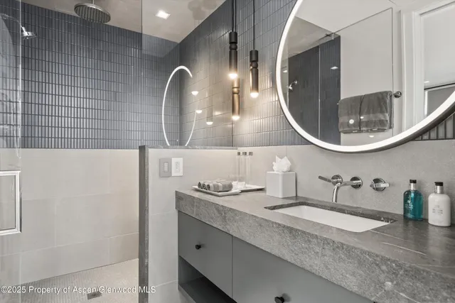 a bedroom with bed and a large window