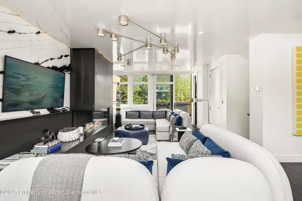 a living room with furniture fireplace and a flat screen tv
