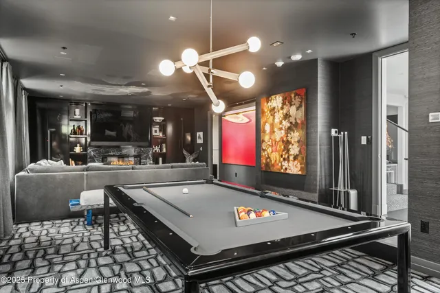 a bathroom with a sink mirror a toilet and a shower