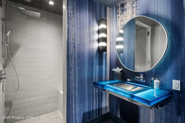 a bathroom with a tub and shower