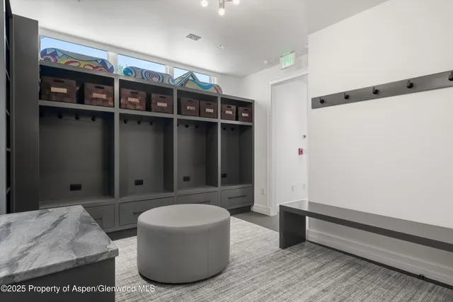 a bathroom with a toilet a sink and a mirror