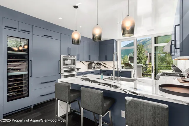 a kitchen with a counter space cabinets and appliances