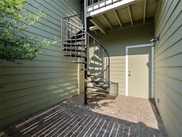 a view of stairs and wooden floor