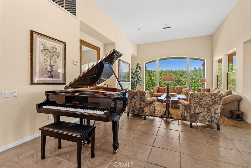 1228 Verdugo Road Palm Springs, CA 92262 - Photo 3 of 25 Beautiful formal living room with fireplace and dramatic high ceilings
