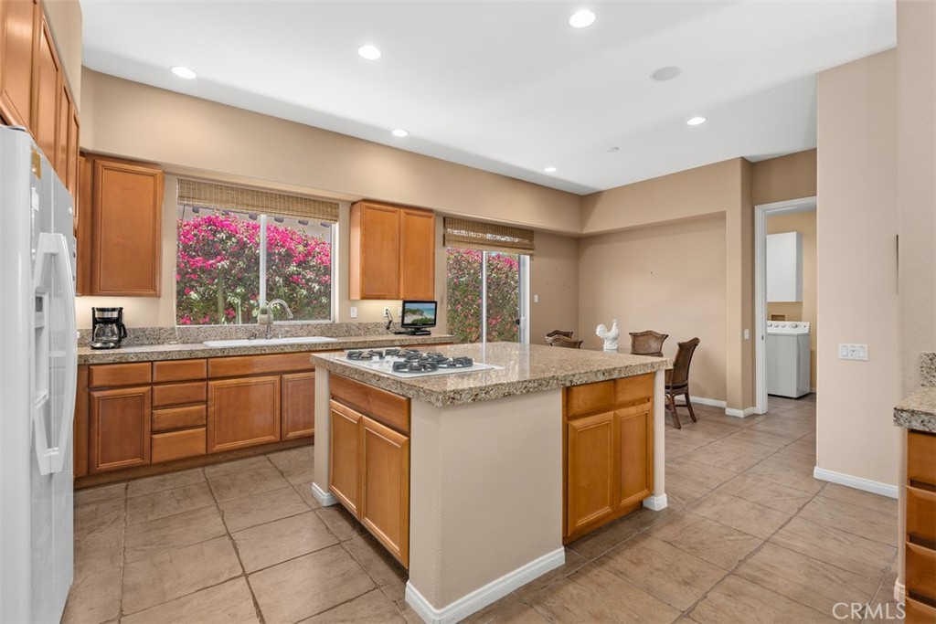 1228 Verdugo Road Palm Springs, CA 92262 - Photo 7 of 25 Center island with kitchen nook and slider to side yard