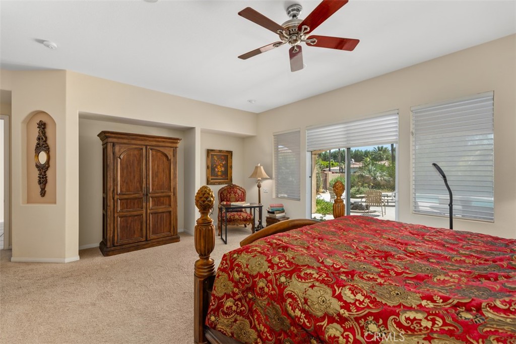 1228 Verdugo Road Palm Springs, CA 92262 - Photo 9 of 25 Primary bedroom with ceiling fan and slider to pool area