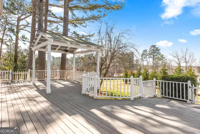 a view of a swimming pool with a yard