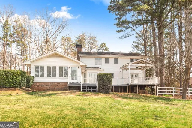 a view of swimming pool with a yard