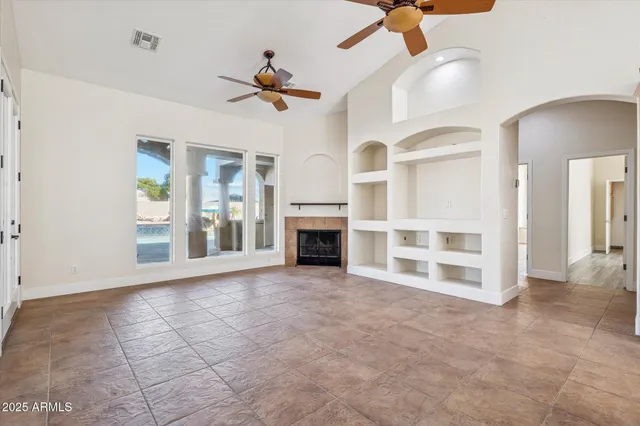 a view of a kitchen with furniture and a ceiling fan
