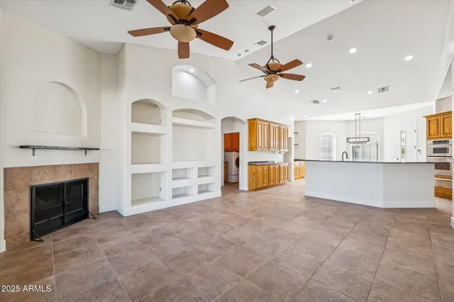 a kitchen with stainless steel appliances granite countertop a refrigerator and a stove