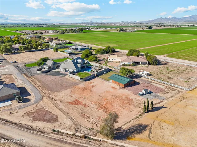 a view of a street with a big yard