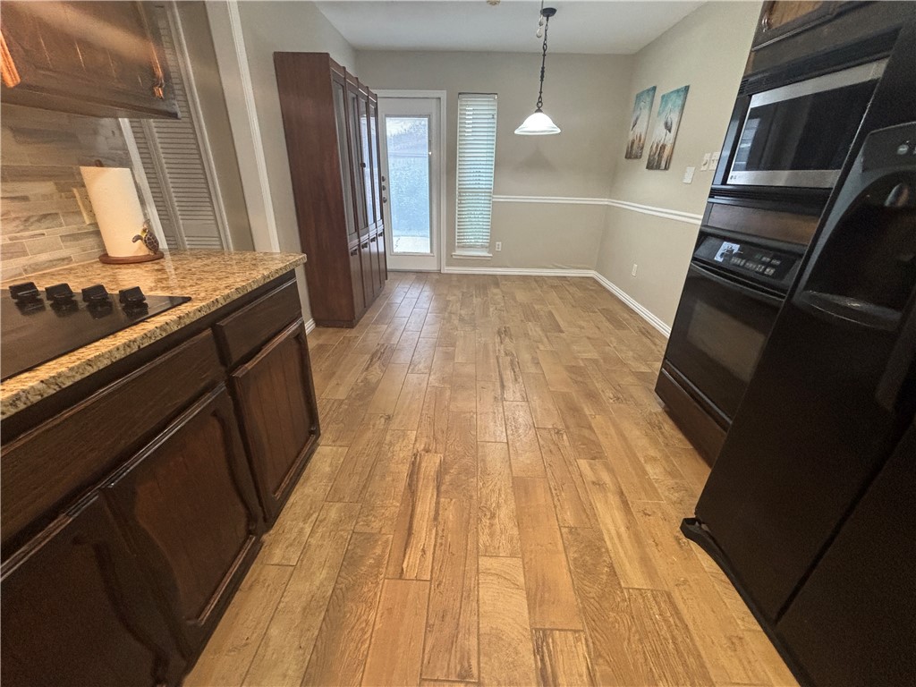 4957 Shadowbend Drive Corpus Christi, TX 78413 - Photo 34 of 35 a view of a kitchen from a hallway