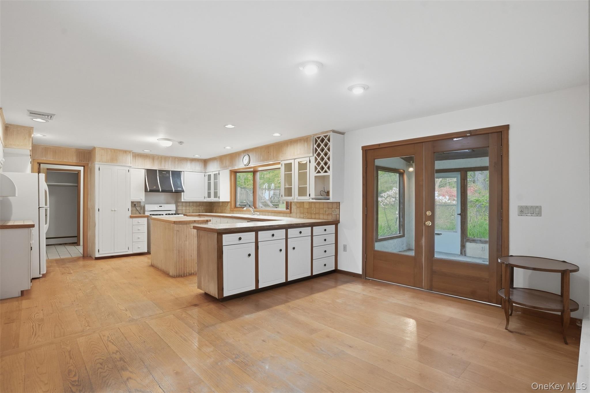 435 Samsonville Road Kerhonkson, NY 12446 - Photo 10 of 37 a large white kitchen with a large window