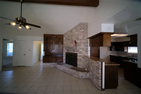 a kitchen with a sink and a fireplace