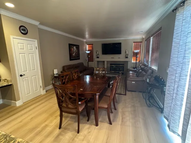 a dining room with furniture and window