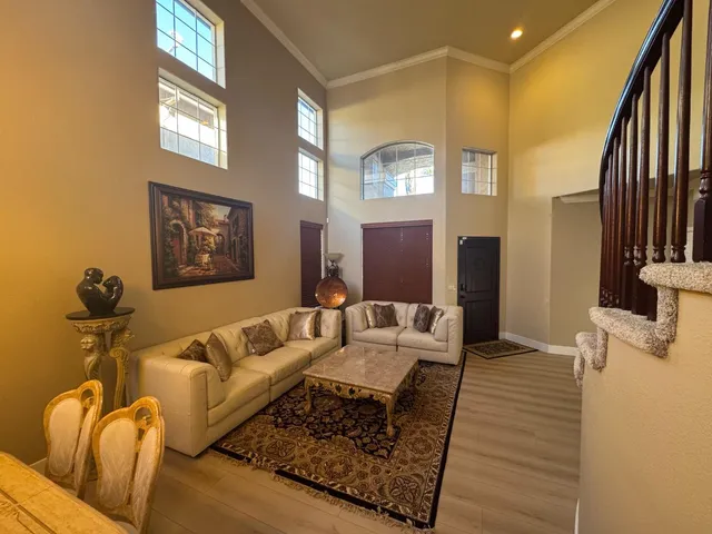 a living room with furniture and a rug