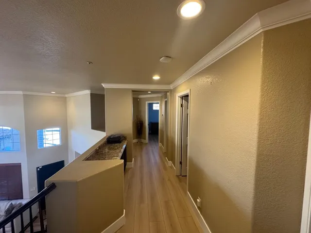 a bathroom with a granite countertop sink a mirror and shower