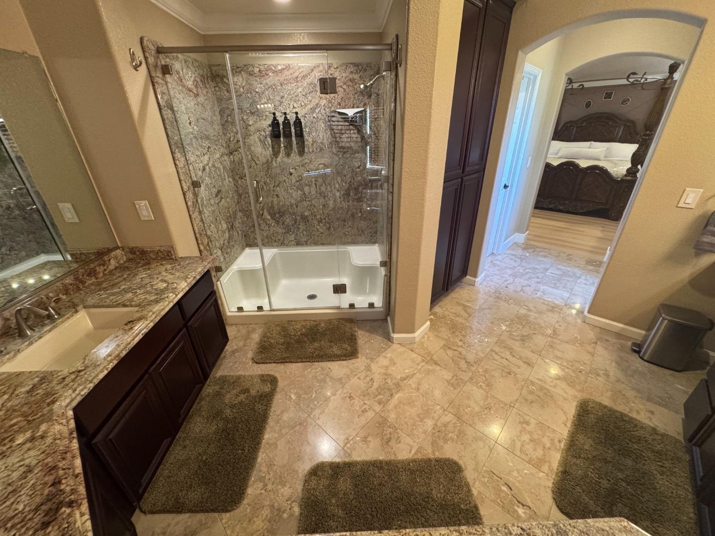 10 Rhine Circle Salinas, CA 93906 - Photo 29 of 50 a bathroom with a granite countertop sink a mirror and shower