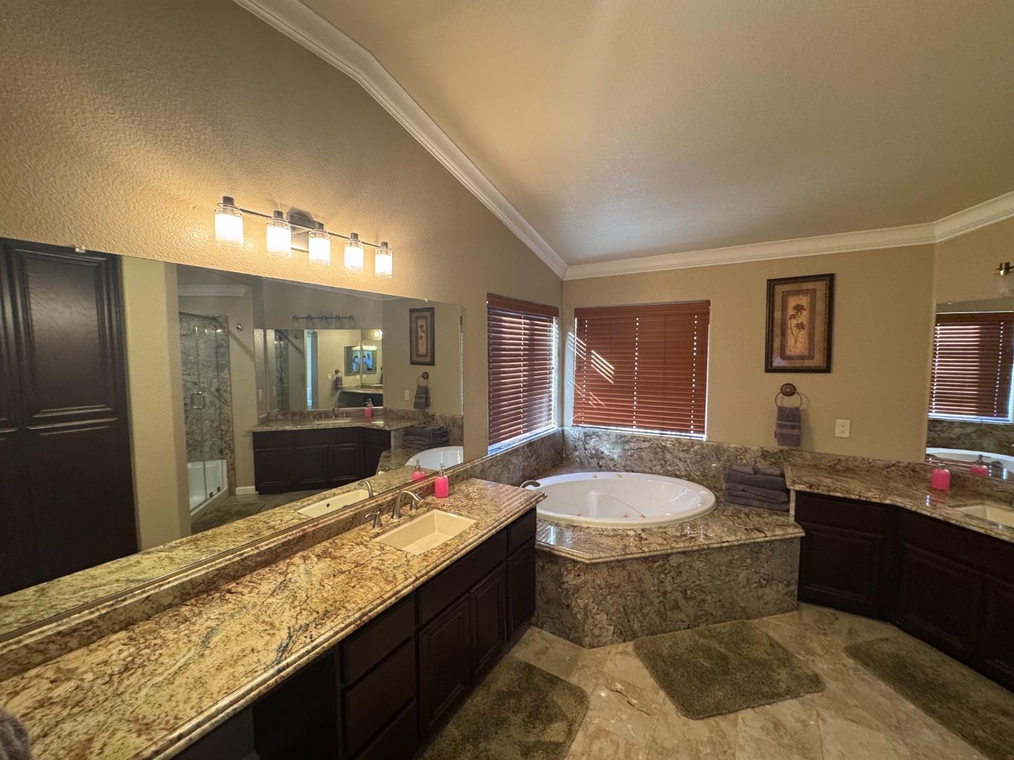 10 Rhine Circle Salinas, CA 93906 - Photo 31 of 50 a spacious bathroom with a granite countertop tub sink and mirror