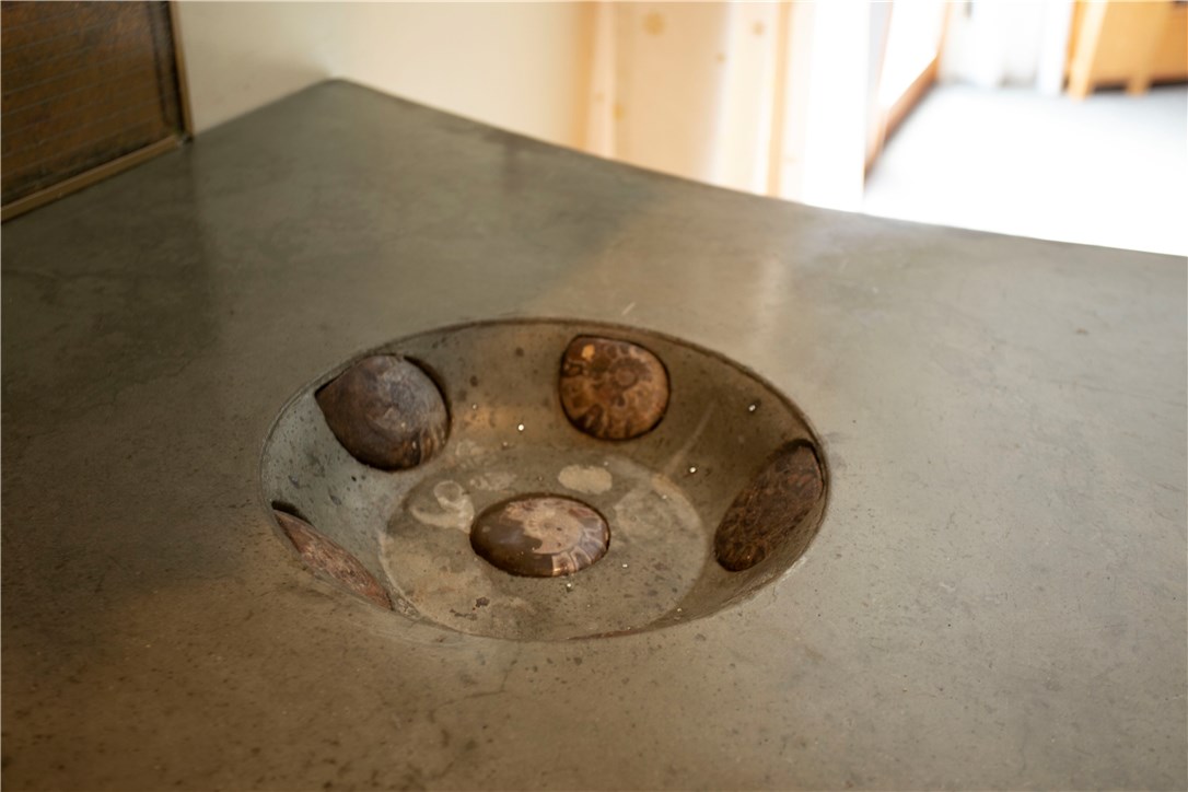 2066 Boston Neck Road North Kingstown, RI 02874 - Photo 11 of 35 Another unique feature of the concrete counters is this sweet little built in ice bucket, complete with drain and uplights. Perfect to keep your wine or a few beers chilled.