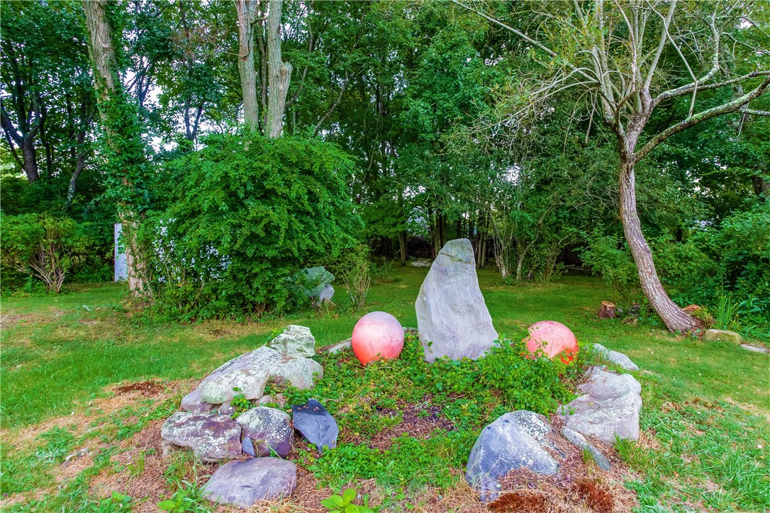 2066 Boston Neck Road North Kingstown, RI 02874 - Photo 24 of 35 This yard seems to go on and on with so much to explore.