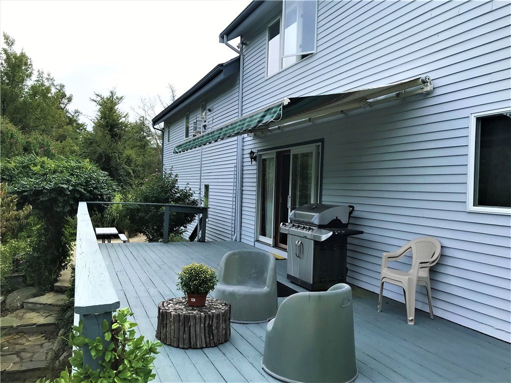 2066 Boston Neck Road North Kingstown, RI 02874 - Photo 26 of 35 Awning can be retracted half way for shade options.