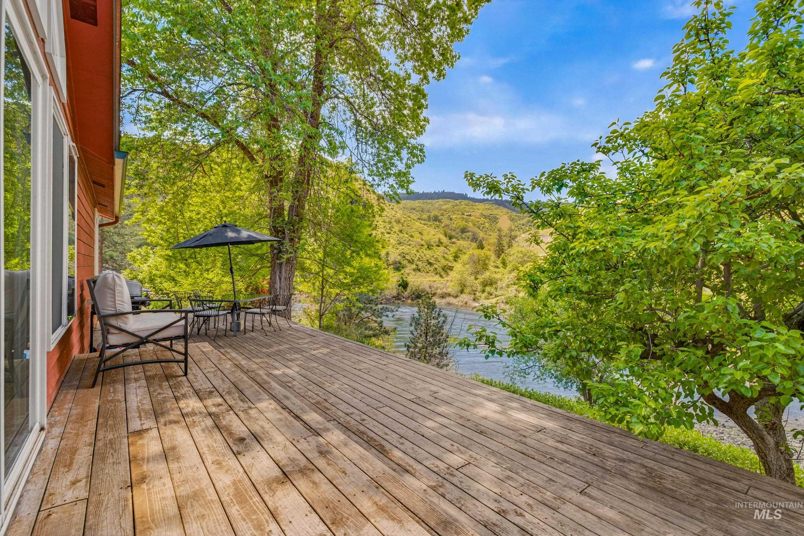 151 Cow Creek Road Lucile, ID 83542 - Photo 39 of 50 Expansive wood-finish deck with a waterfront setting