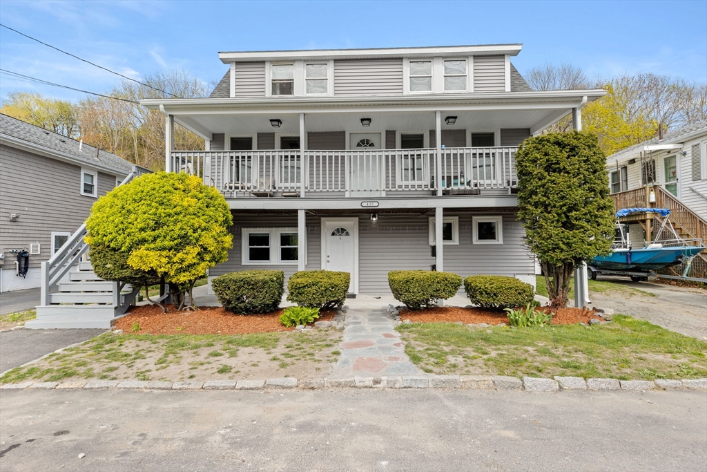 435 Newport Road Hull, MA 02045 - Photo 1 of 35 a front view of a house with a yard and glass windows
