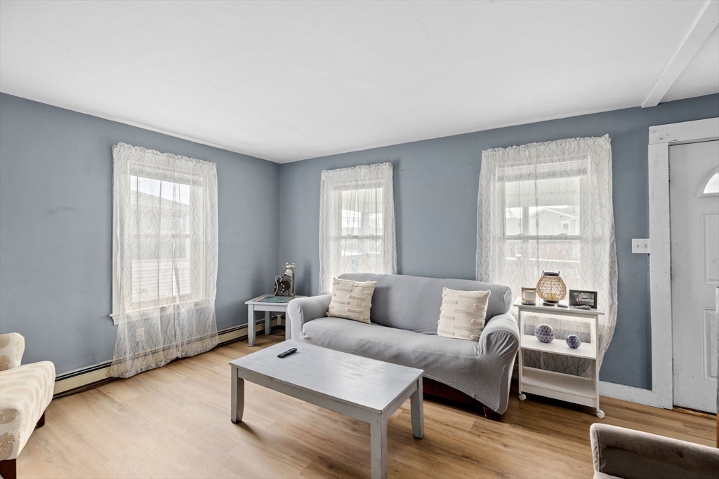 435 Newport Road Hull, MA 02045 - Photo 13 of 35 a living room with furniture and windows
