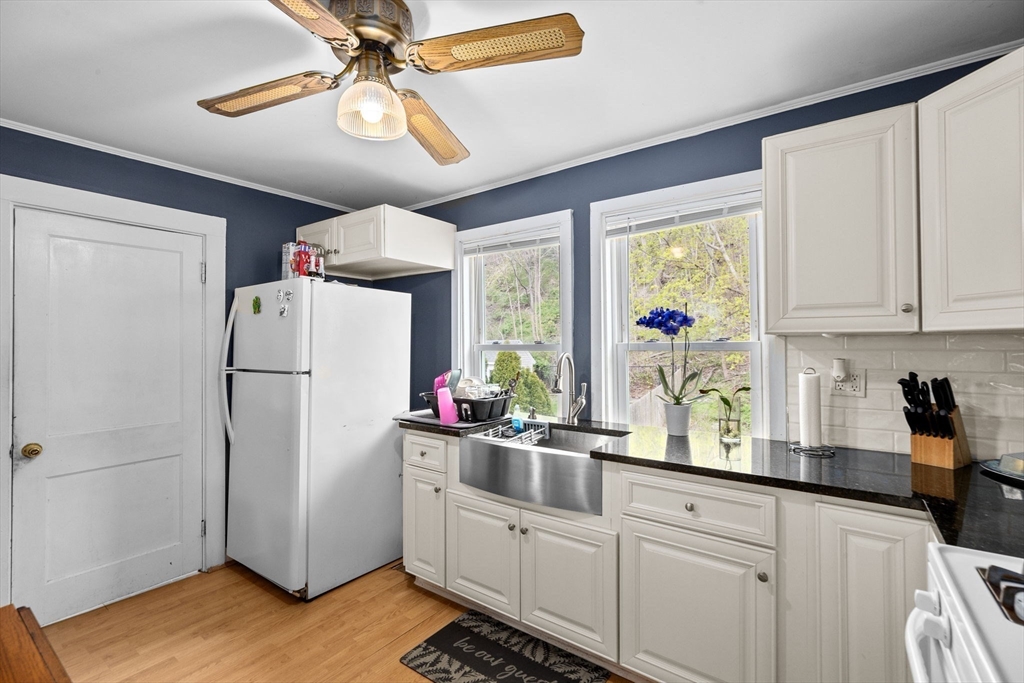 435 Newport Road Hull, MA 02045 - Photo 20 of 35 a kitchen with refrigerator cabinets and window