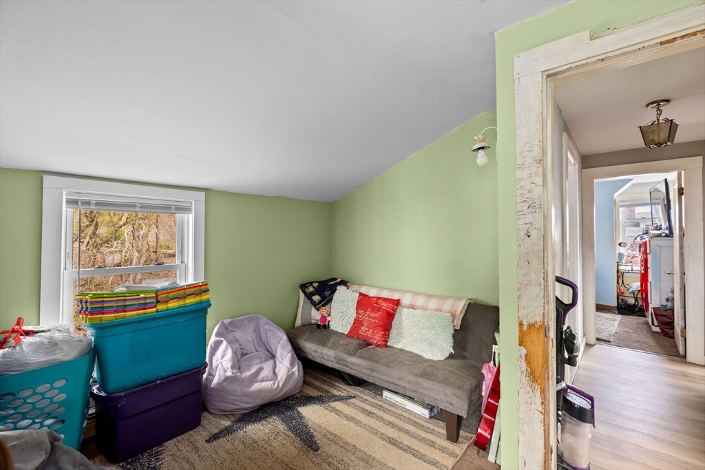 435 Newport Road Hull, MA 02045 - Photo 24 of 35 a living room with furniture and a window