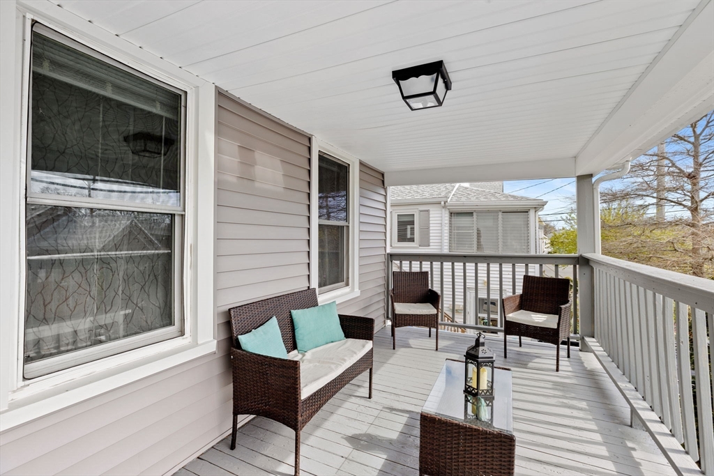 435 Newport Road Hull, MA 02045 - Photo 26 of 35 a balcony with furniture and a window