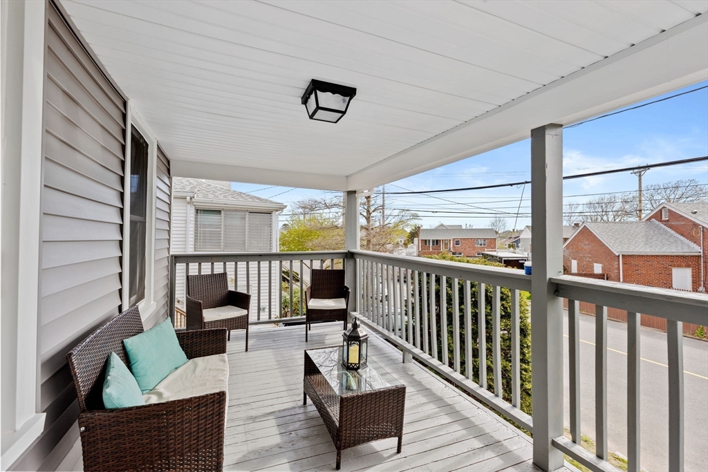 435 Newport Road Hull, MA 02045 - Photo 27 of 35 a balcony with furniture and wooden floor