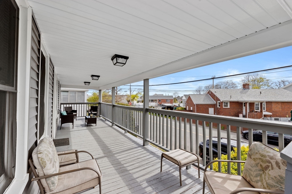 435 Newport Road Hull, MA 02045 - Photo 32 of 35 a view of a patio with couches table and chairs and wooden floor