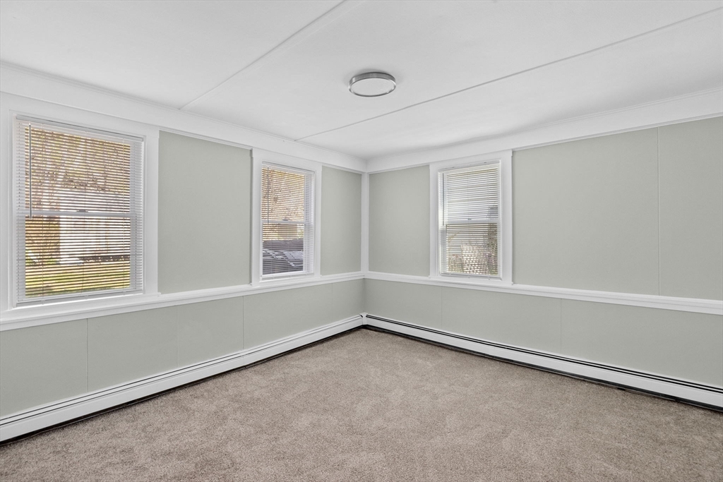435 Newport Road Hull, MA 02045 - Photo 4 of 35 an empty room with a window