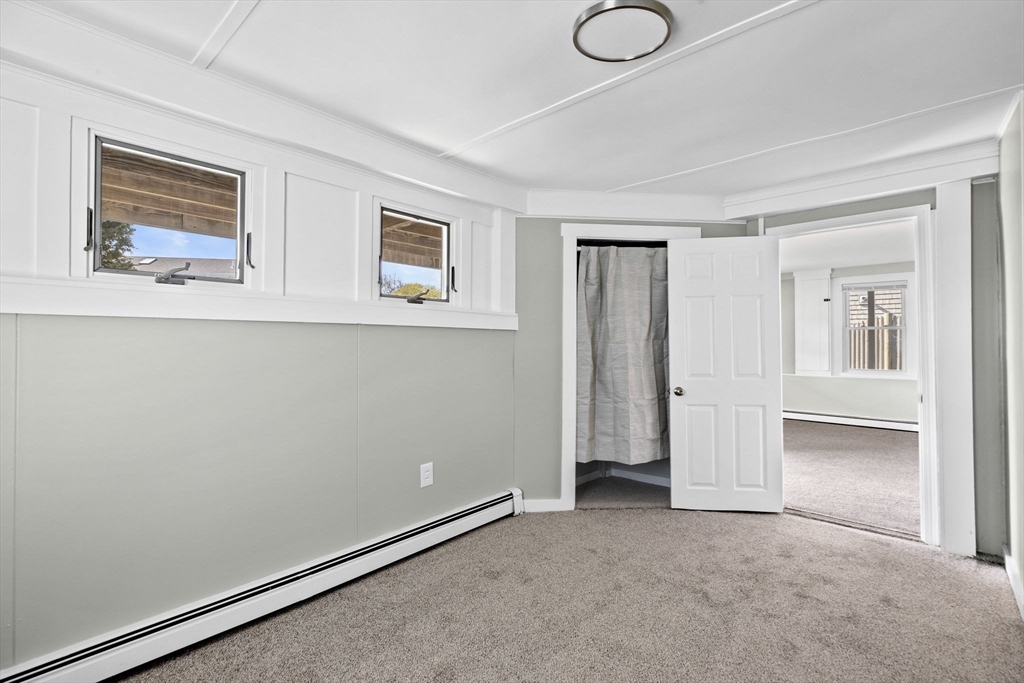 435 Newport Road Hull, MA 02045 - Photo 7 of 35 an empty room with windows and closet