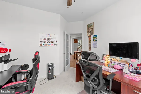a kitchen that has a lot of stainless steel appliances wooden floor and cabinets