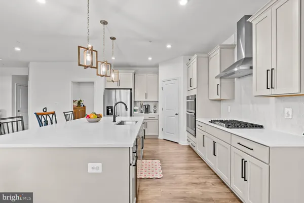 a very nice looking living room with wooden floor and furniture