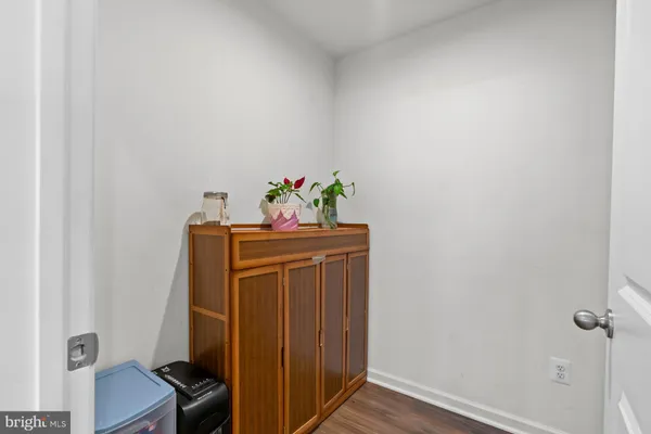 a view of walk in closet with clothes